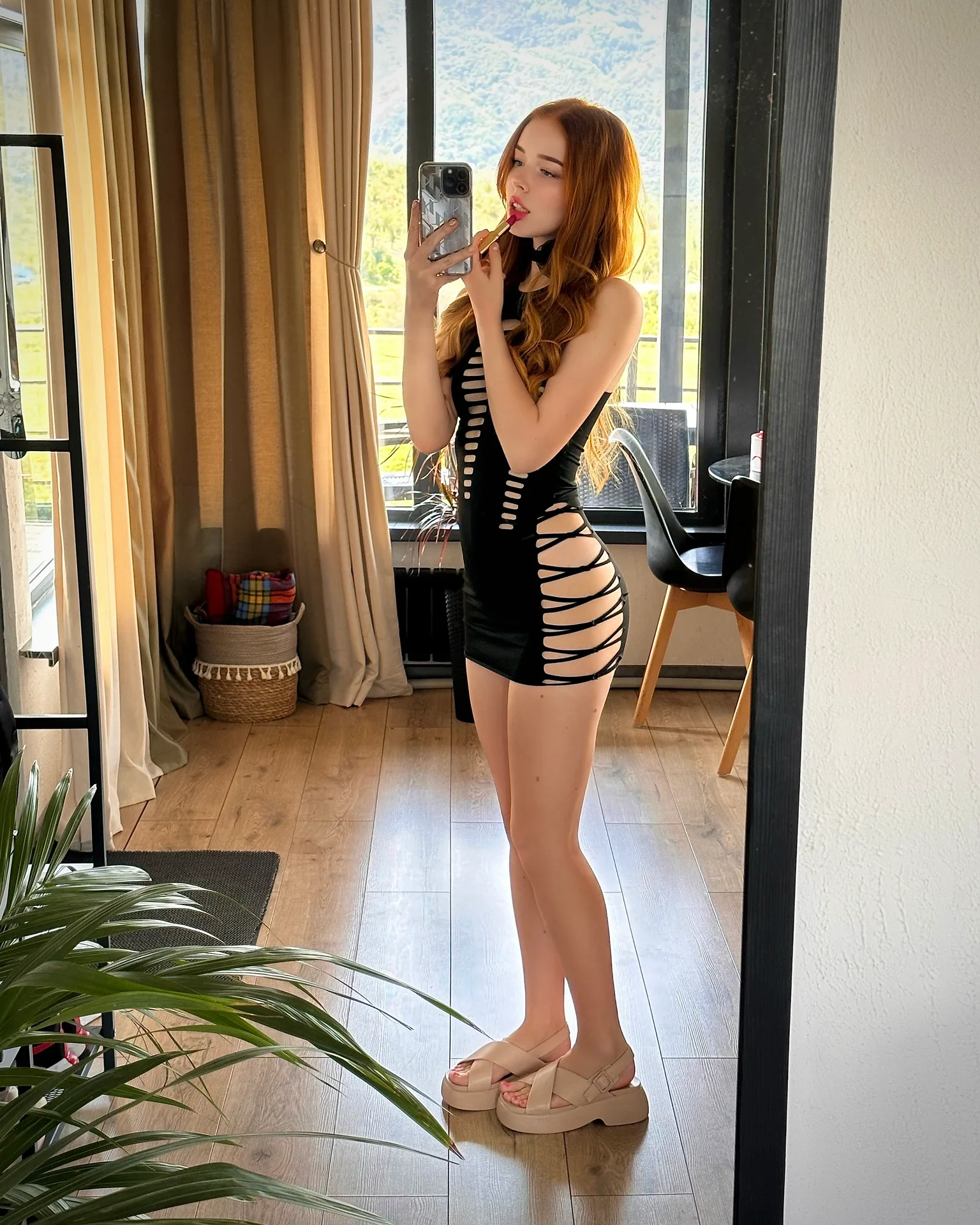 Black cutout dress in a mirror