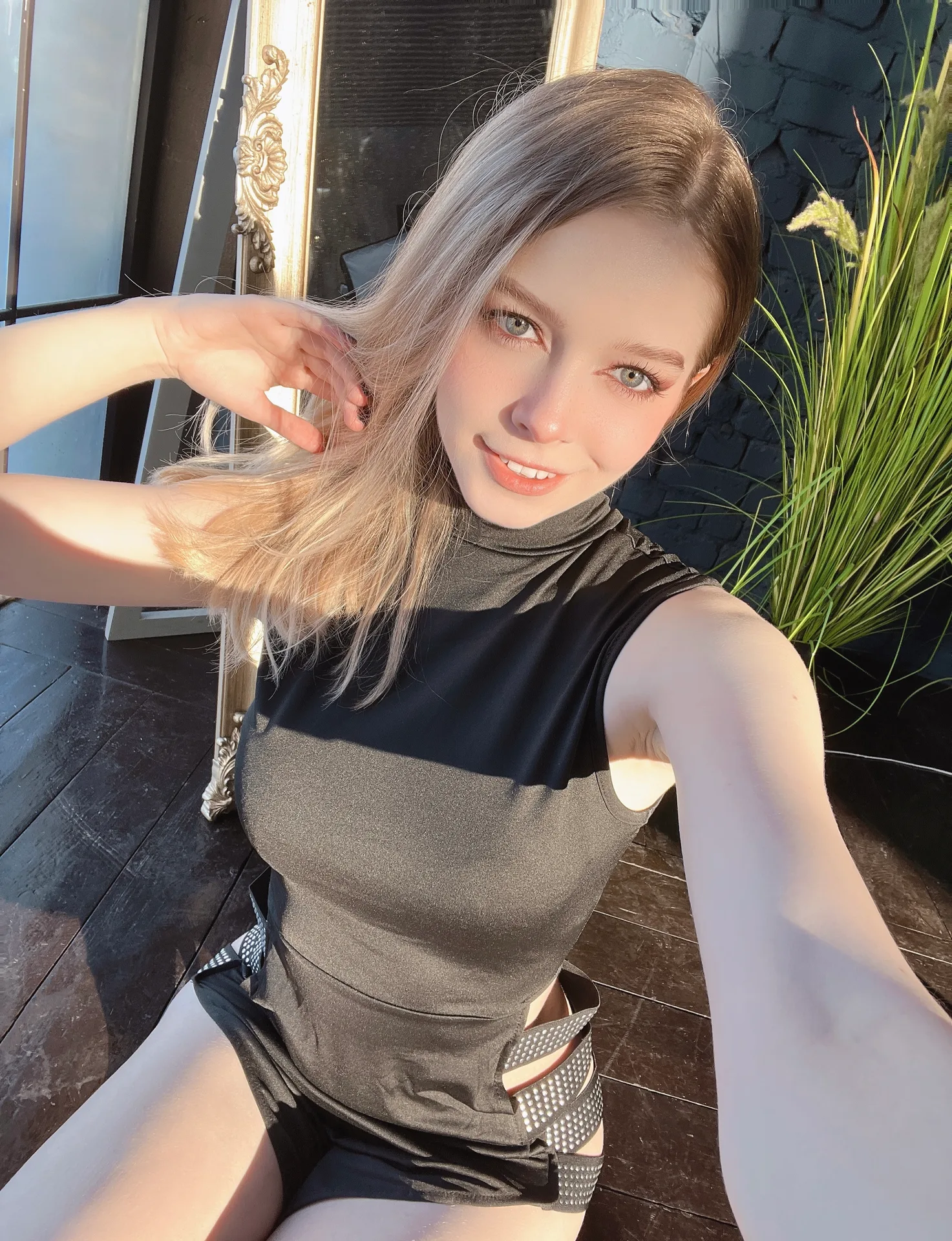 Black sleeveless top indoors