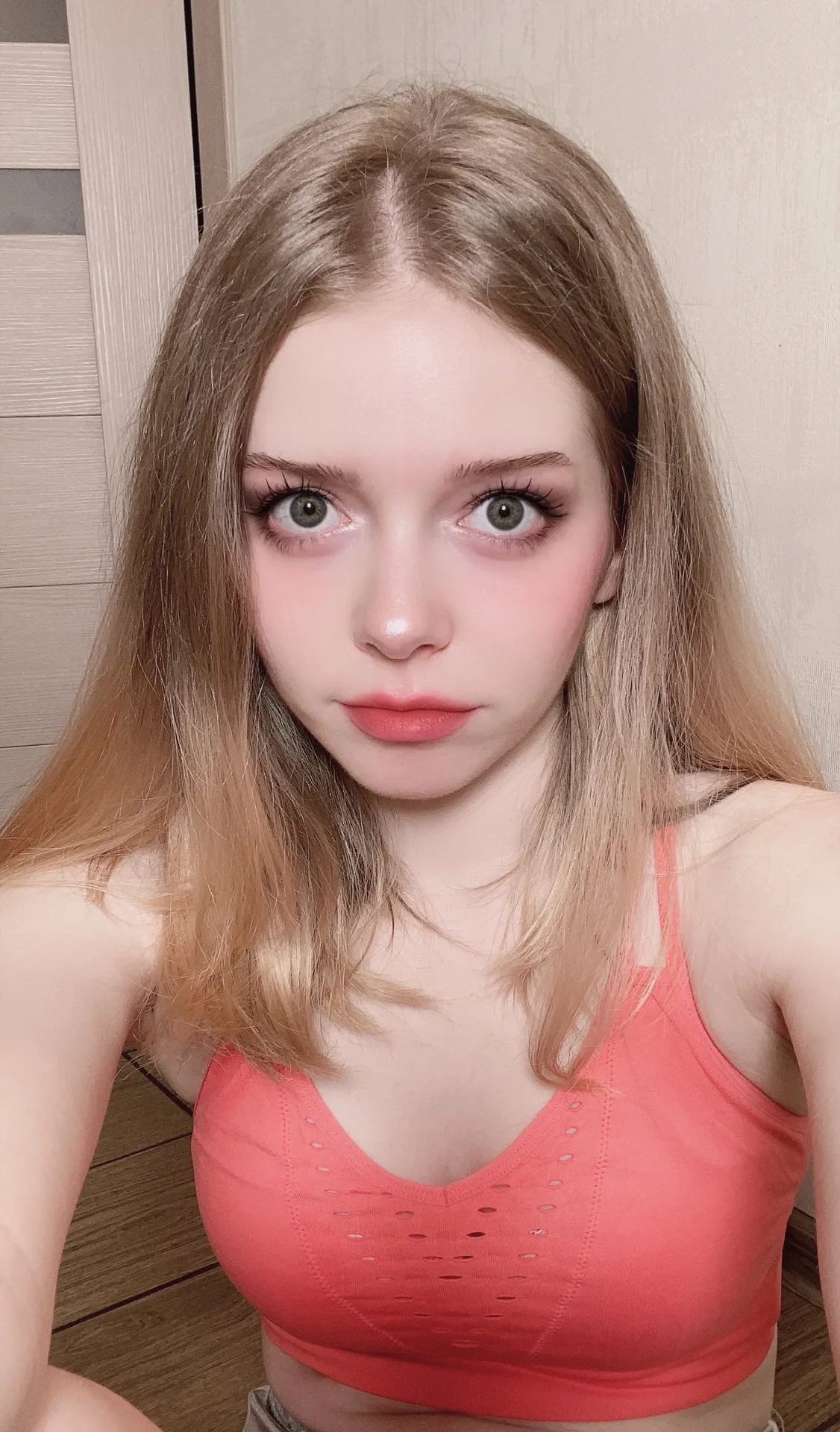 Coral crop top indoors