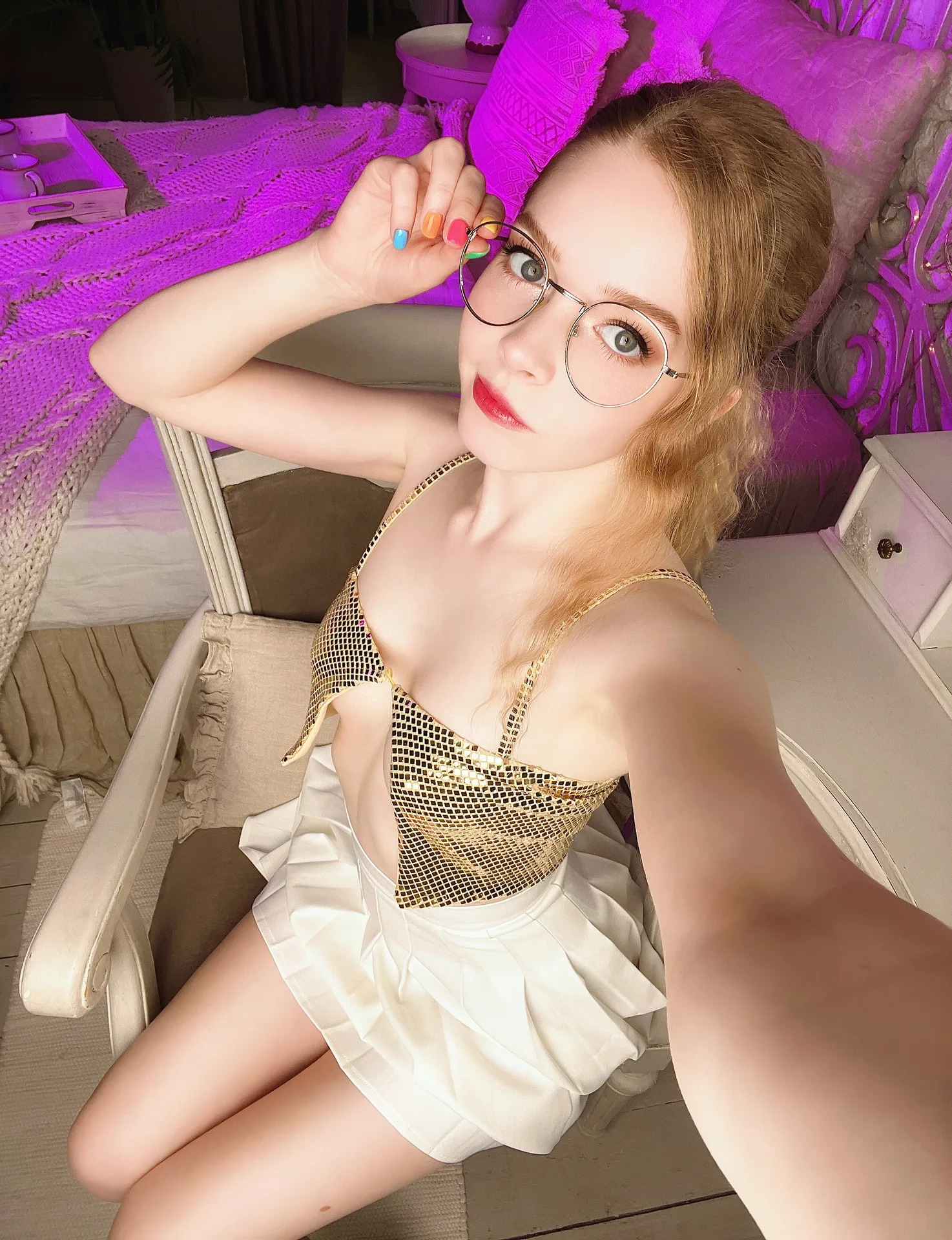 Gold sequin top and white skirt, standing