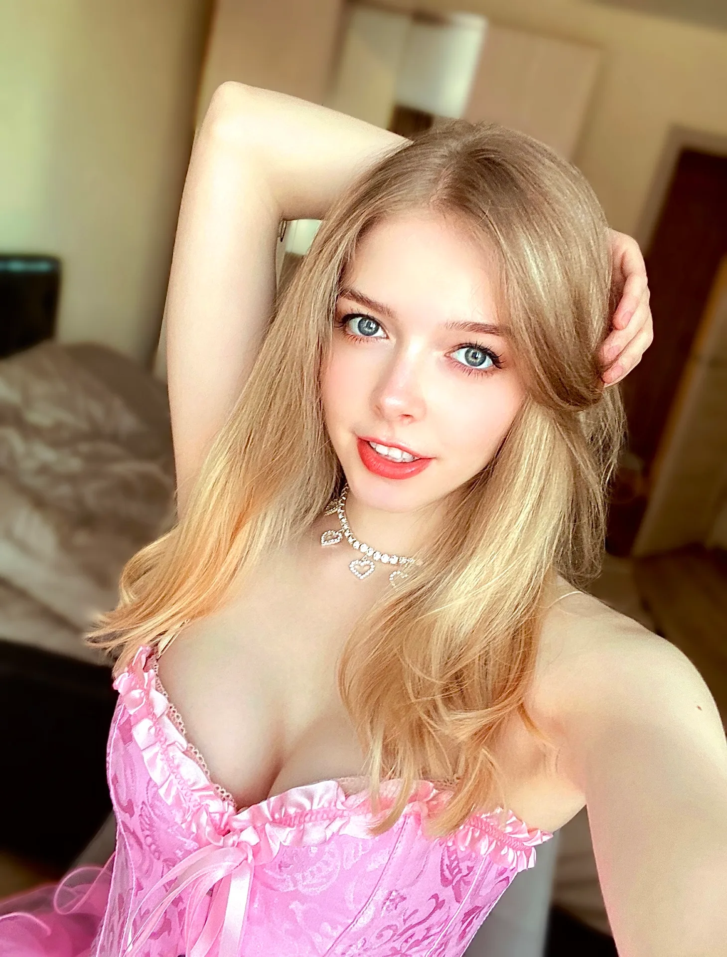 Pink corset top in a bedroom