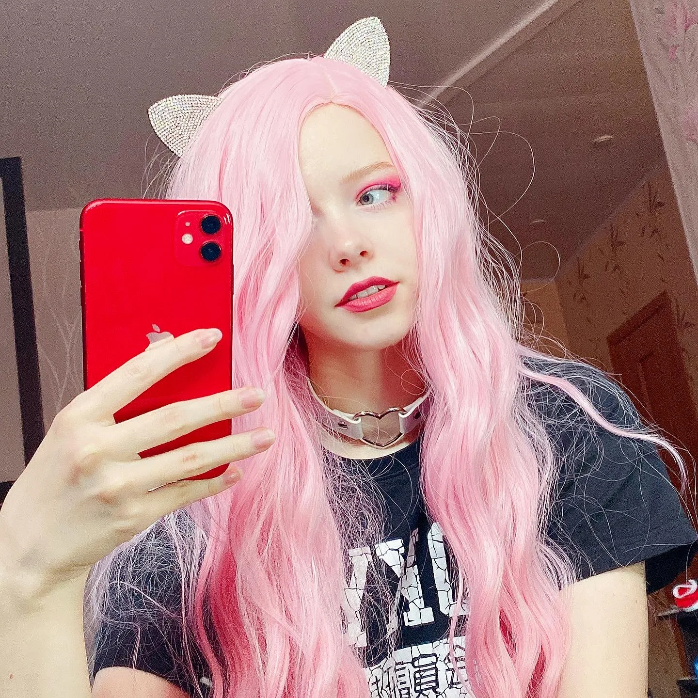 Pink hair and a black T-shirt