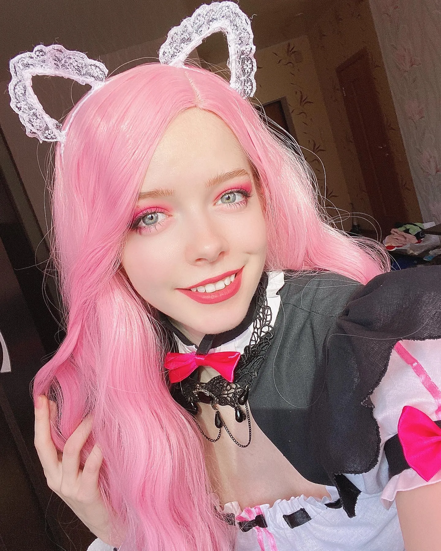 Pink hair and a maid outfit