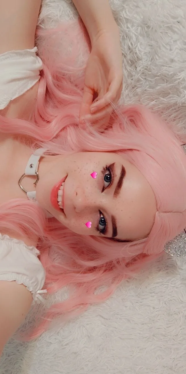 Pink hair and a white top
