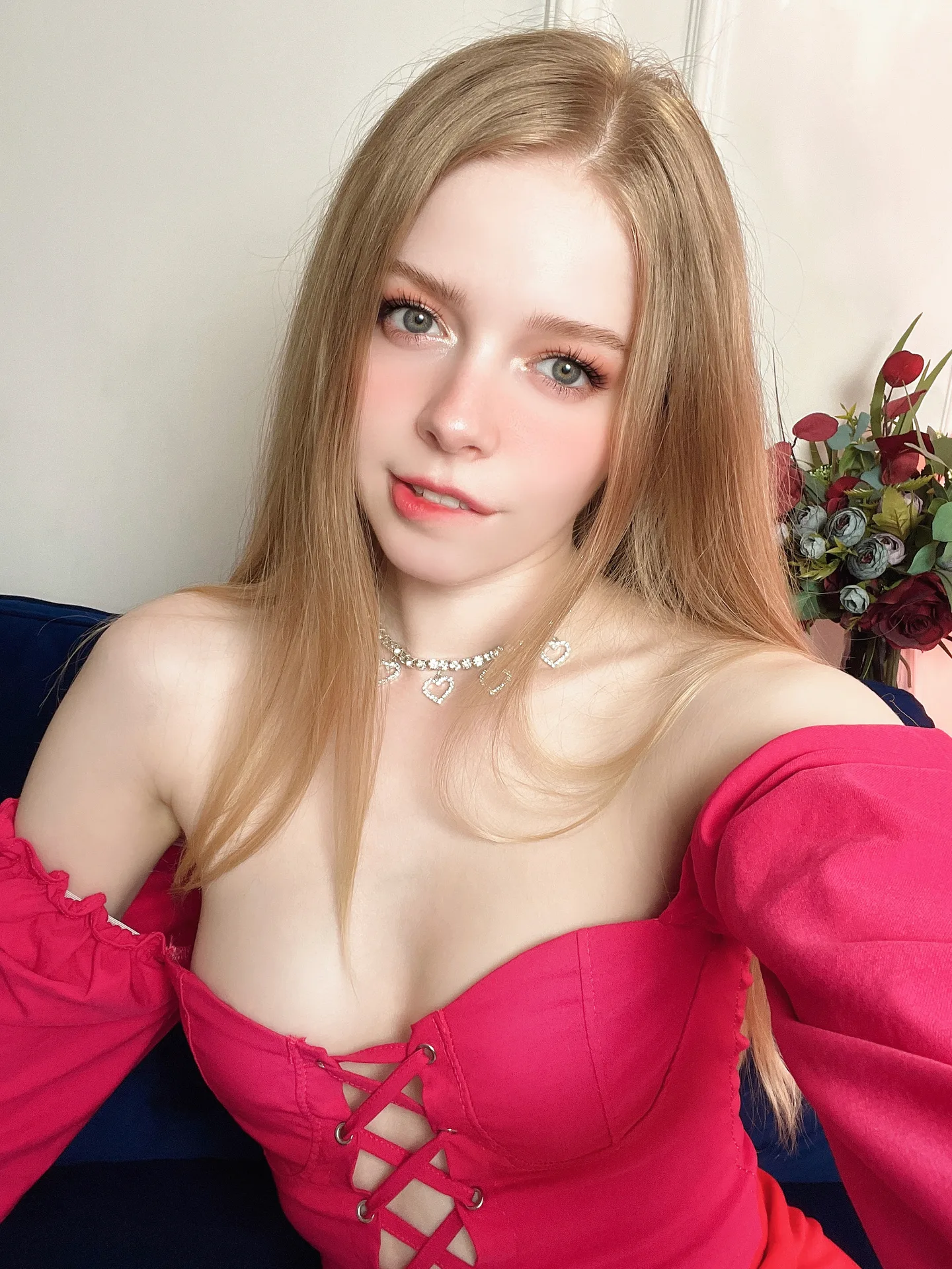 Pink lace-up top on a couch
