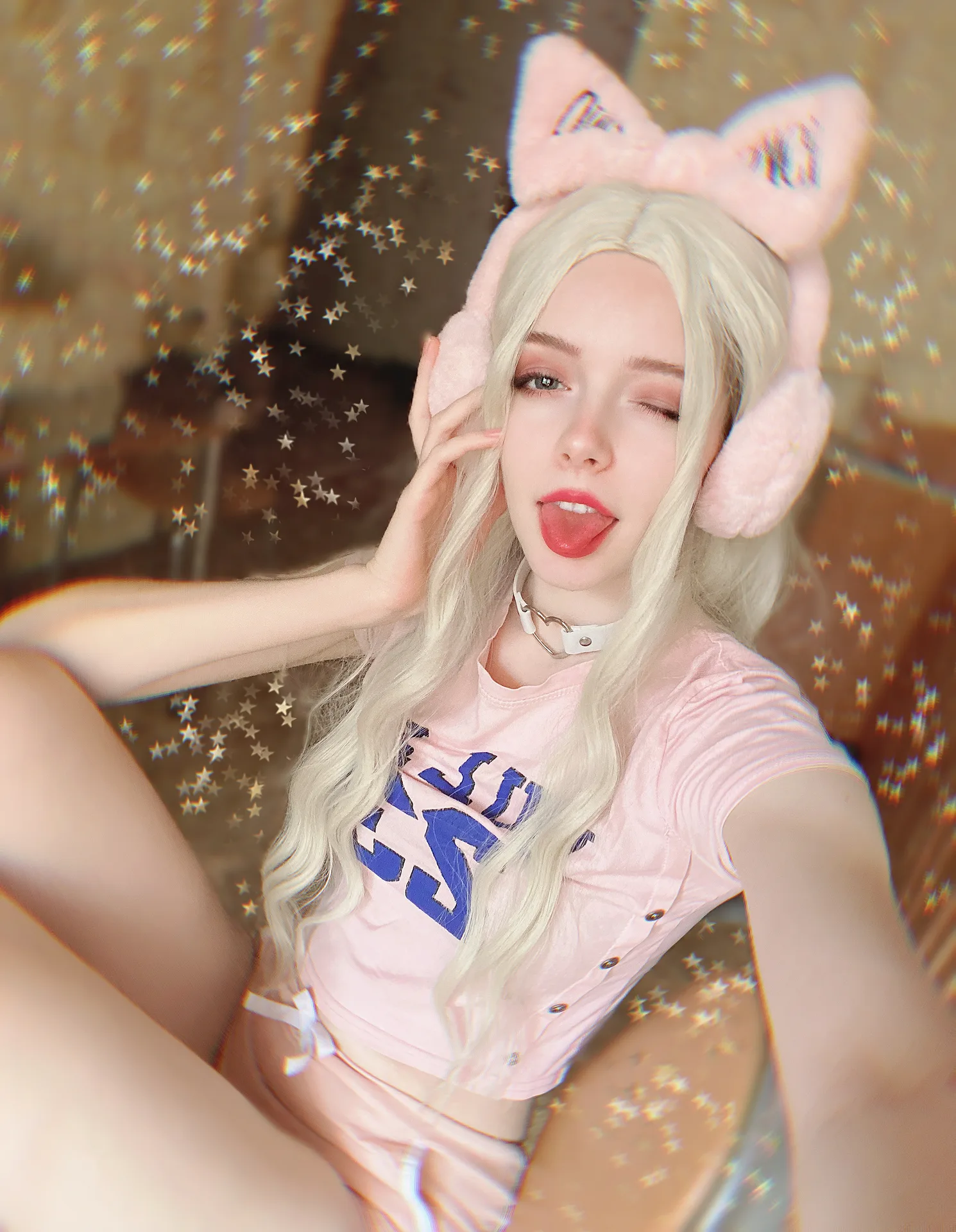Pink t-shirt and shorts with cat-ear headphones
