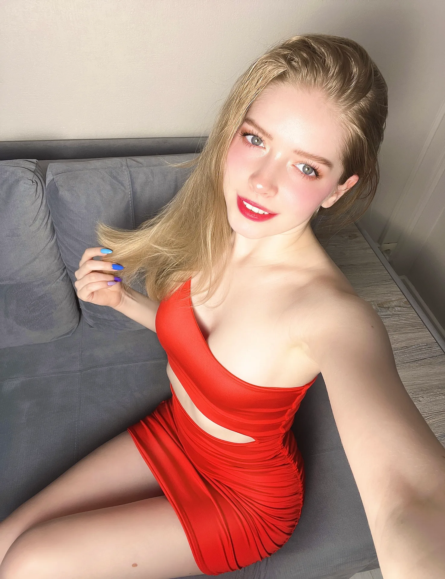 Red crop top and red skirt on a sofa