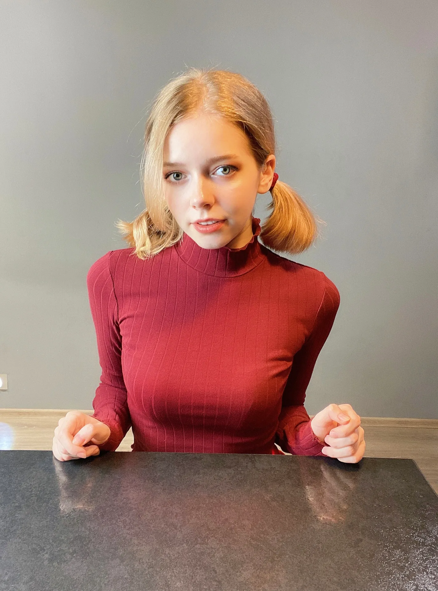 Red turtleneck with pigtails