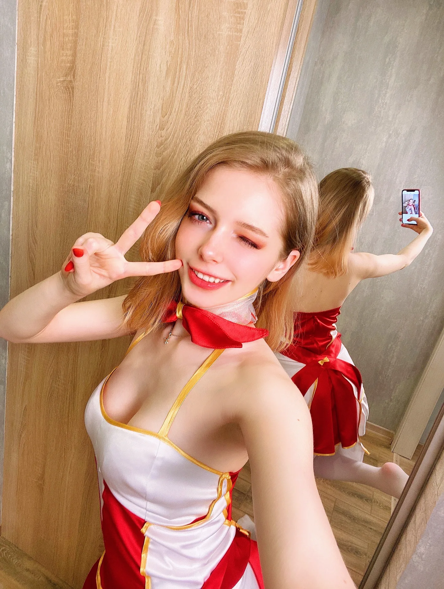 White and red dress by a mirror